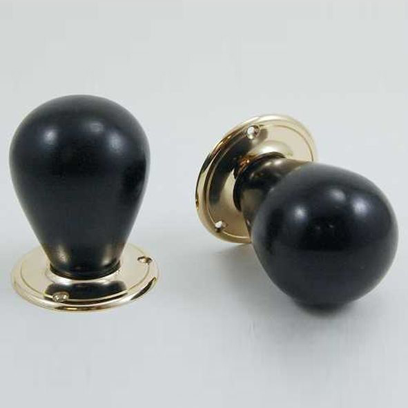 DKF085MXC-PBL  Ebony / Lacquered Brass  Timber Tulip Knobs On Round Roses